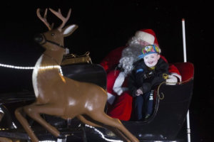 Evan on Santa's Sleigh - Christmas in October