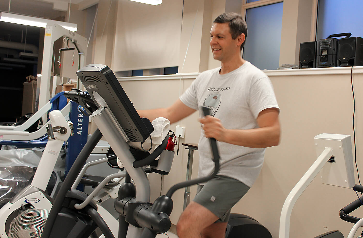 Cancer survivor, James, working out in a gym after surgery.