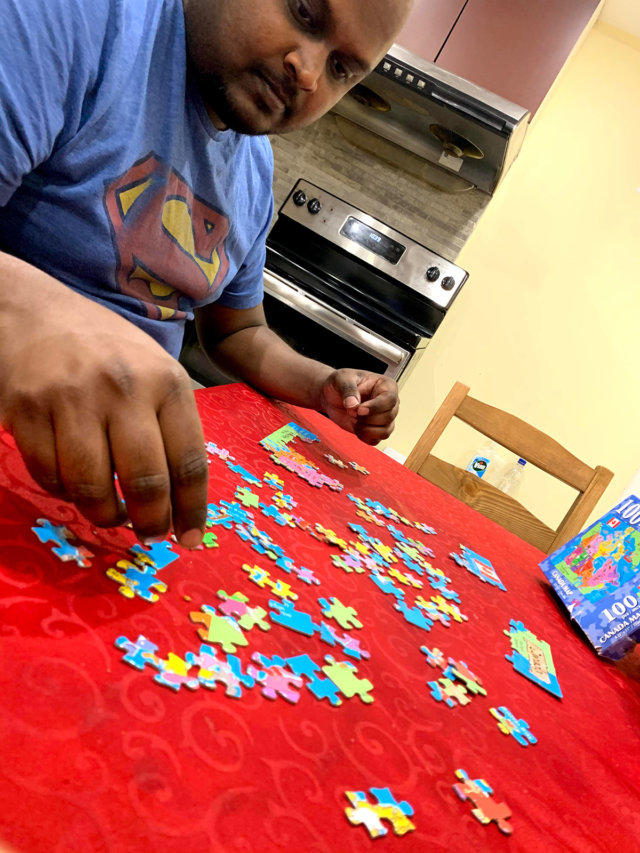 Mani doing a puzzle